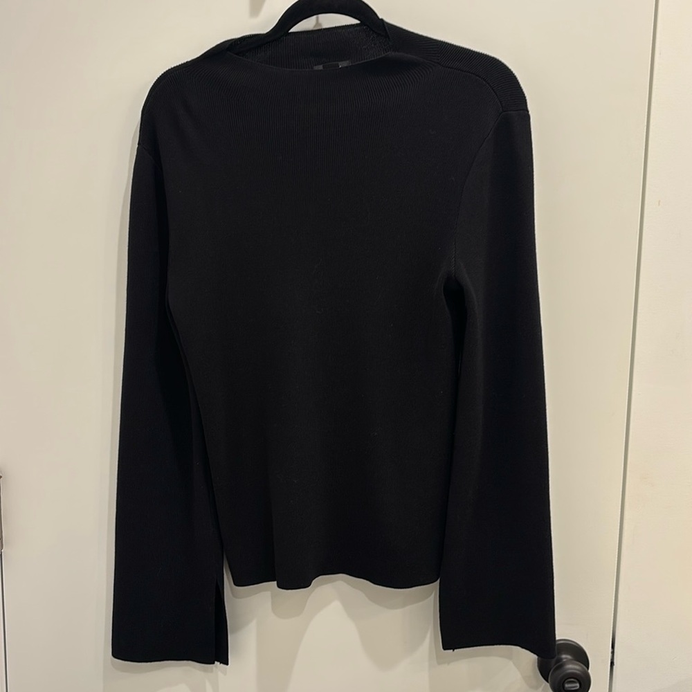 Black sweater with flare sleeves. Very classy, perfect for work or going out